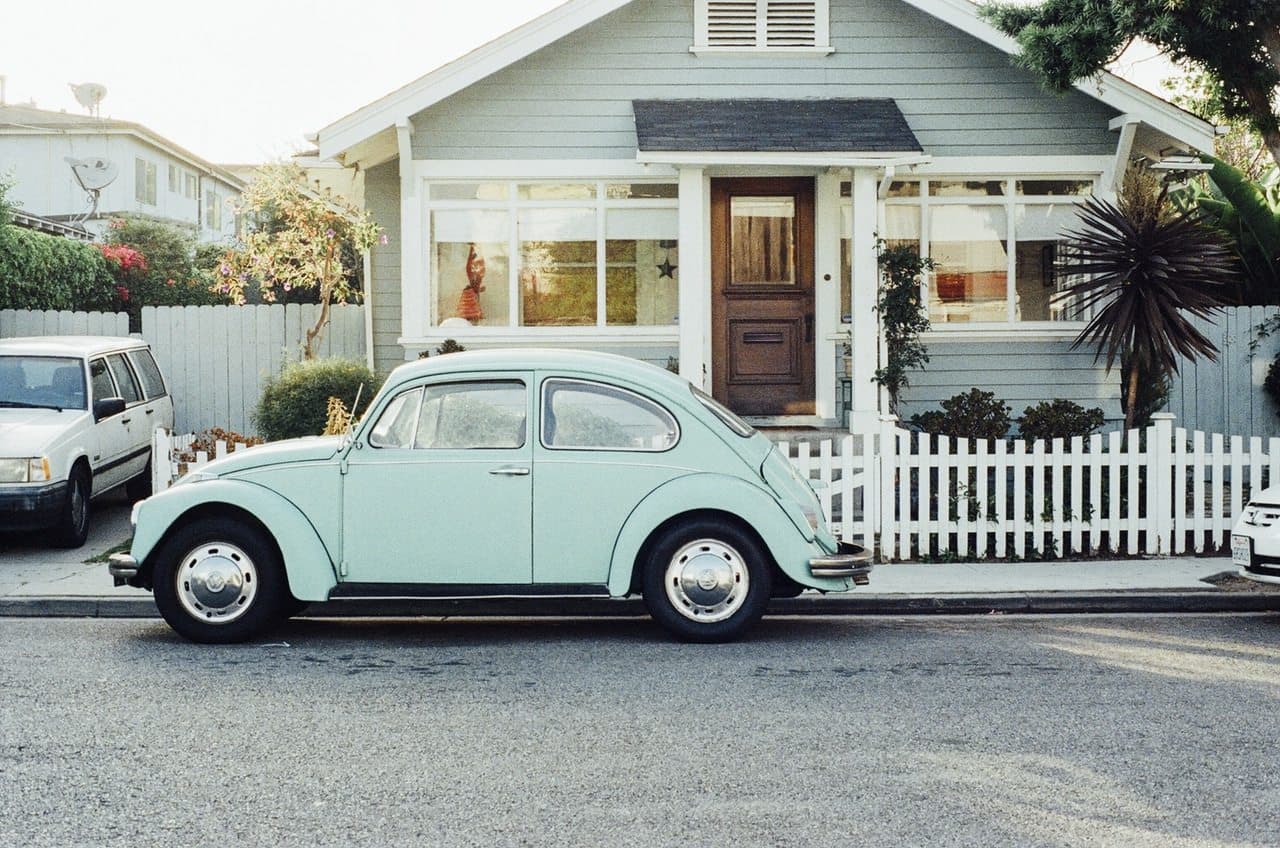 old-vintage-car-in-front-of-house
