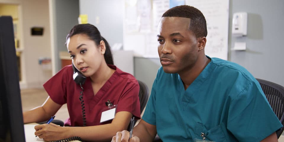 male-and-female-nurse-at-nursing-station