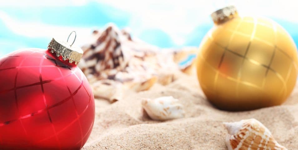 red-and-gold-ornaments-on-beach-with-seashells