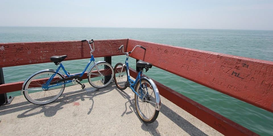 two-blue-bikes-on-pier