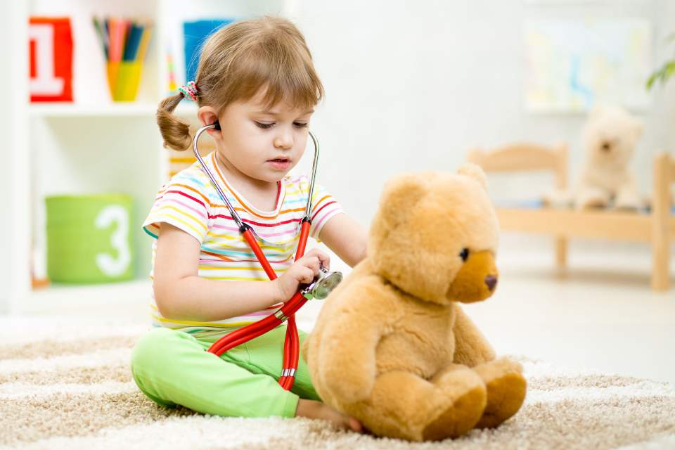 little-girl-with-stethoscope-and-teddy-bear